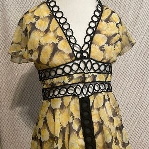 Latinate yellow & black maxi dress with cutouts and a front slit in the middle
